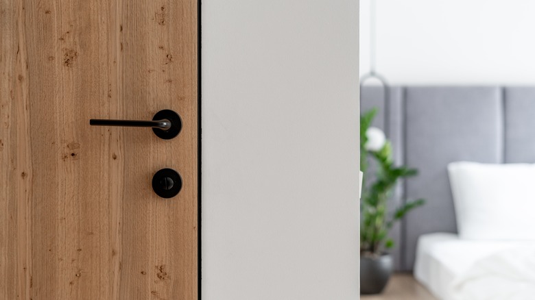 wooden door with black handle