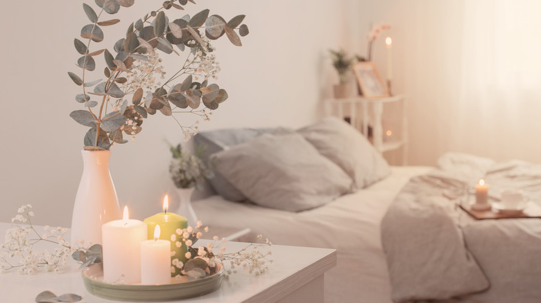 candles lit in a bedroom