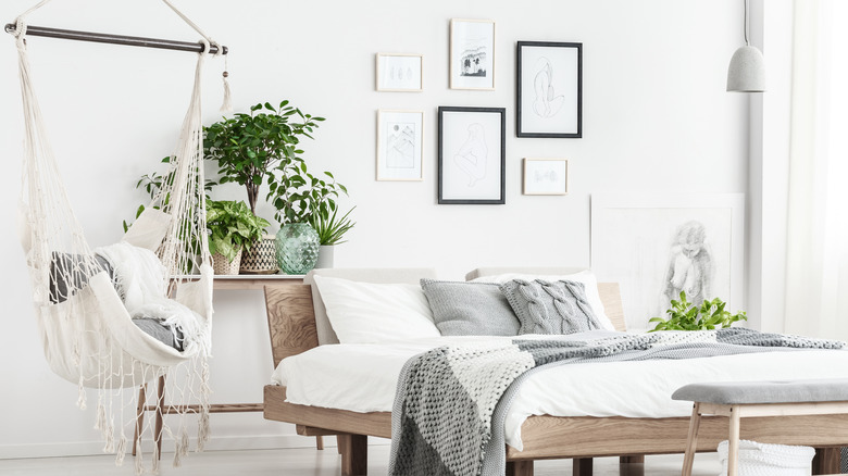 a hammock chair hanging in a bedroom