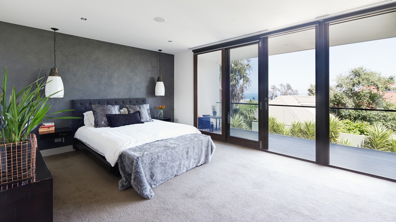 bedroom with soft decor and view of trees