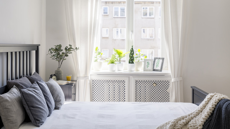 Long white curtains in bedroom