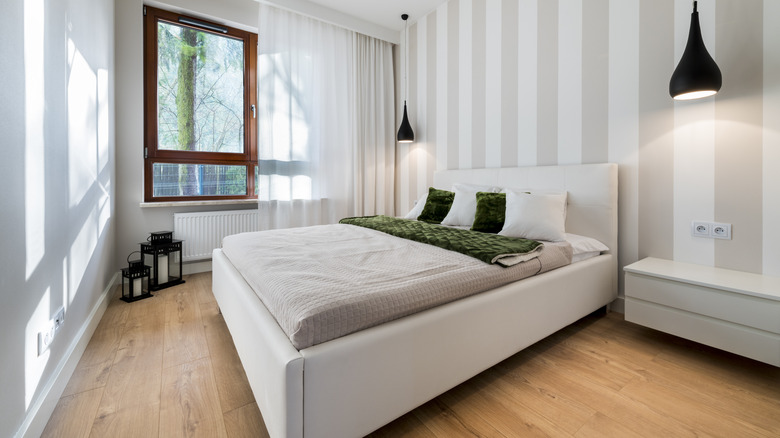 Bedroom with neutral vertical striped wall