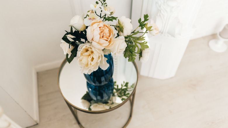 Mirrored end table with flowers