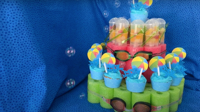 cupcakes on pool noodle stand