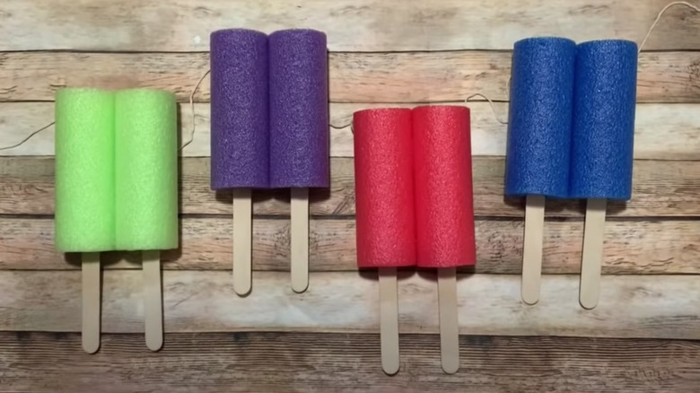 popsicle garland on wood
