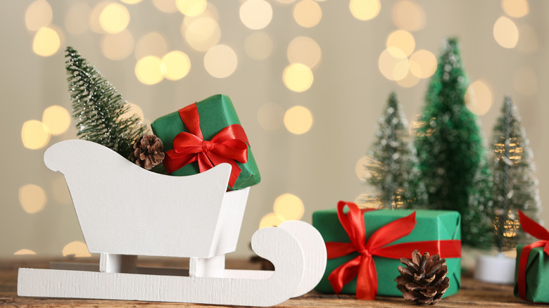 white sleigh with presents