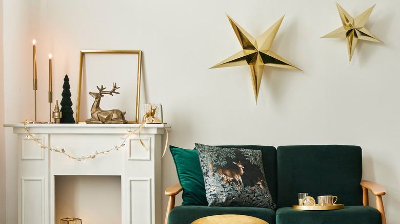 gold stars above green couch
