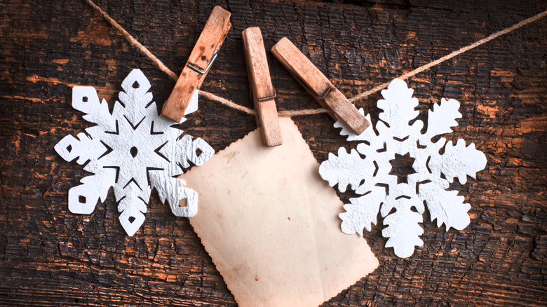 paper snowflakes attached to twine