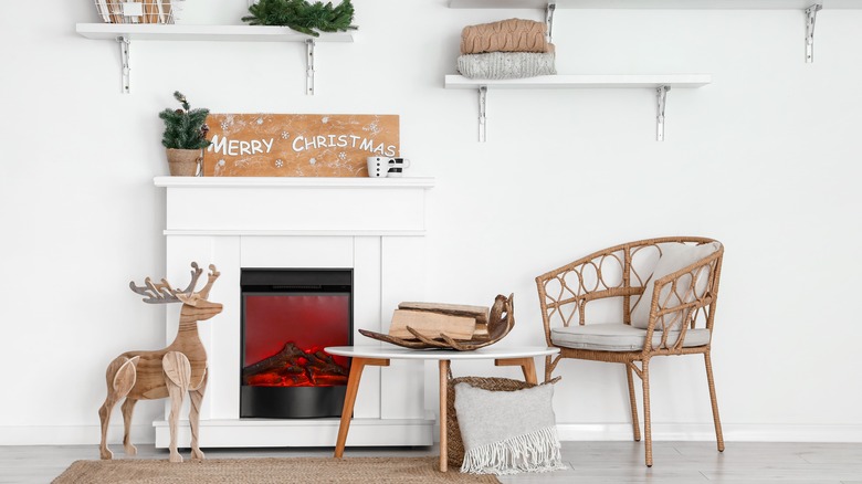 electric fireplace with wooden reindeer