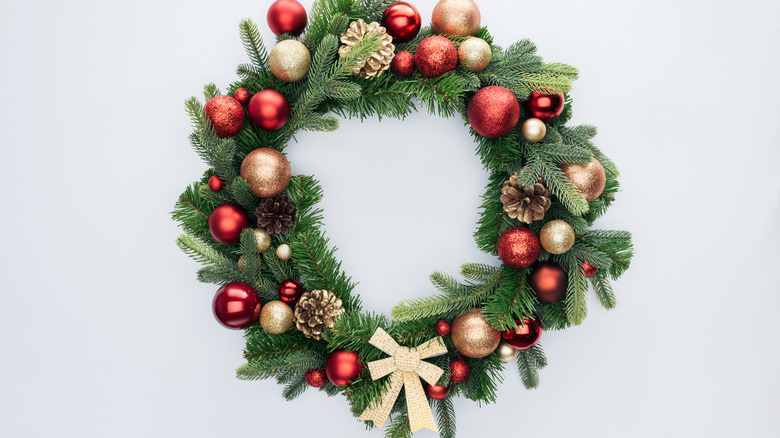 red ornaments on wreath