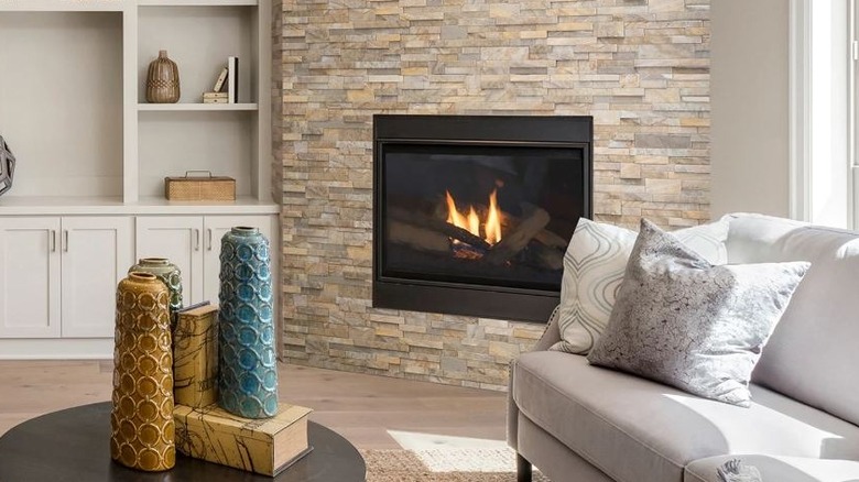 Smart Tiles light 3D stone tiles on living room fireplace