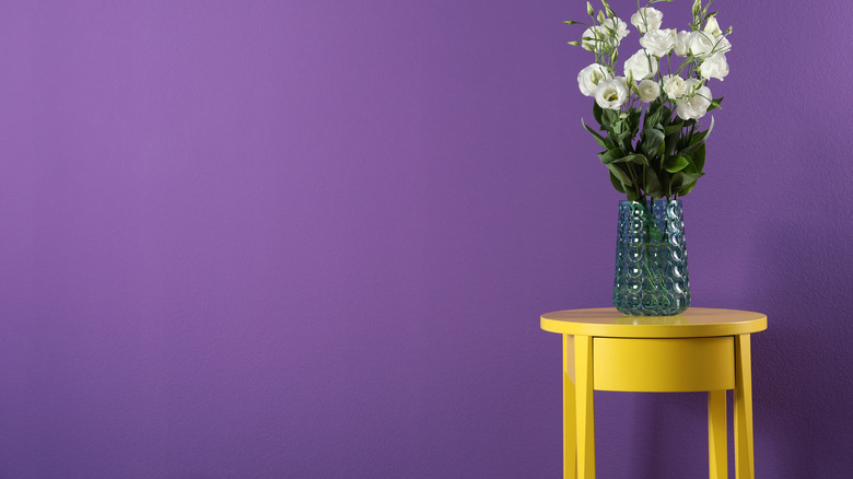 yellow table against purple wall