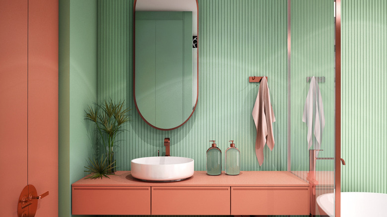 pink vanity with green wall