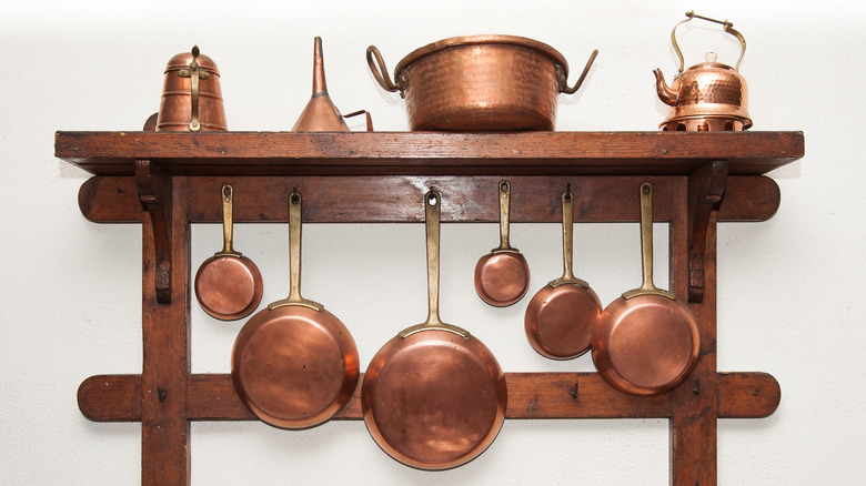 Assorted hanging copper cookware