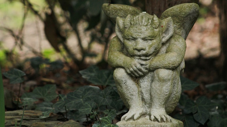 brooding gargoyle stone statue