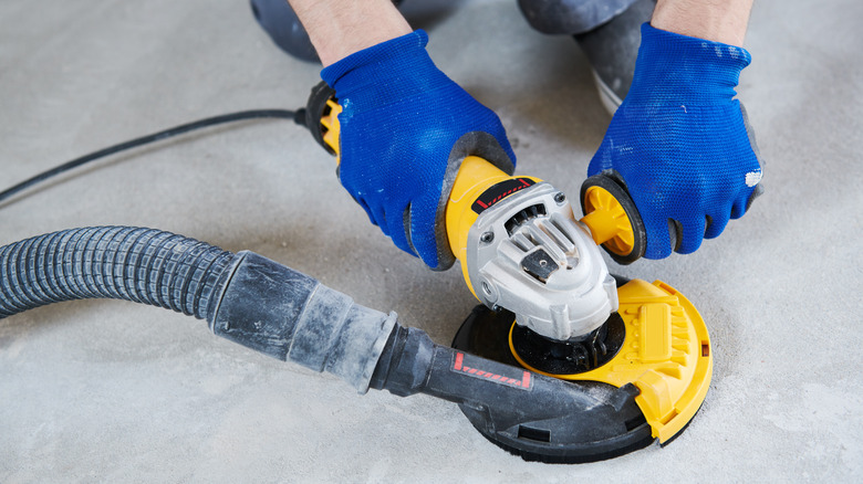 Person using floor grinder