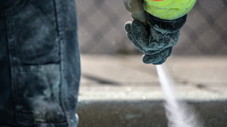 Person using blasting machine