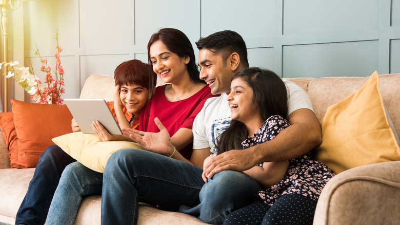 Family looking at tablet computer