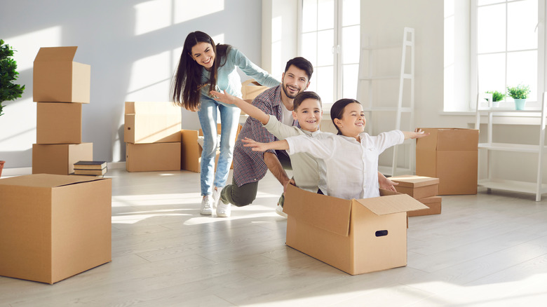 Family unpacking boxes