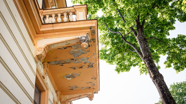 paint peeling underneath balcony