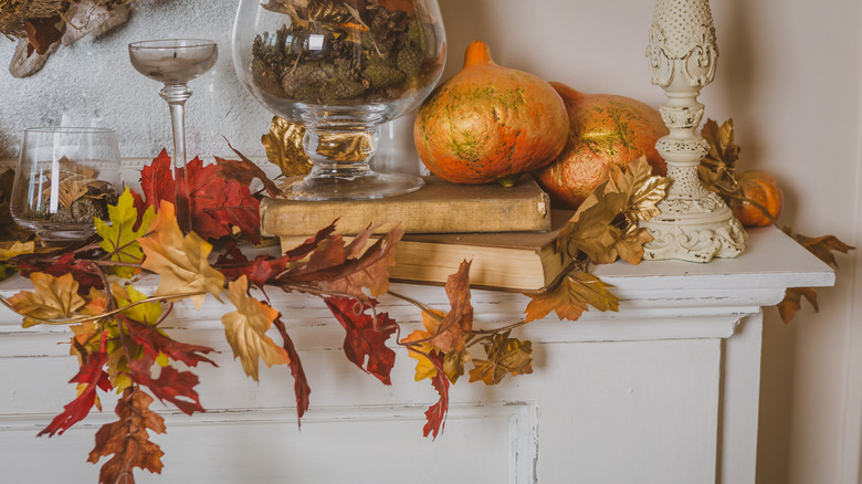 Mantel with pumpkins and leaves