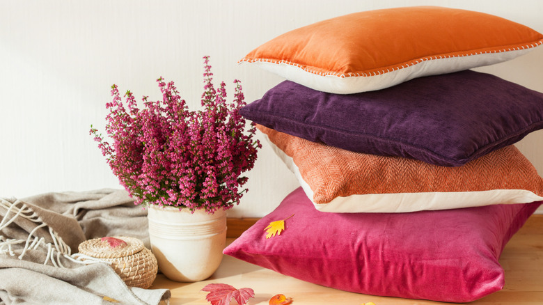 Stack of pillows and flowers