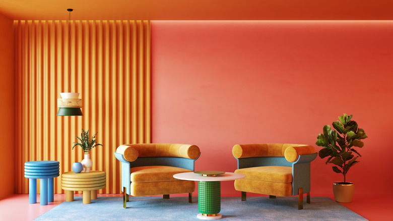 A living room with neon orange walls and ceiling