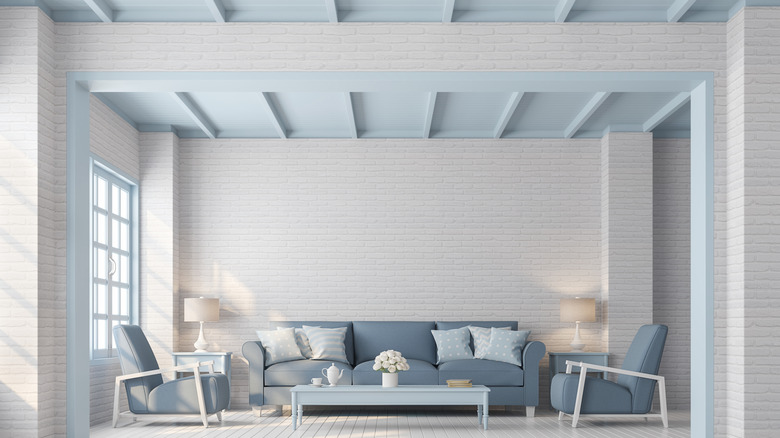 Living room with a sky blue ceiling