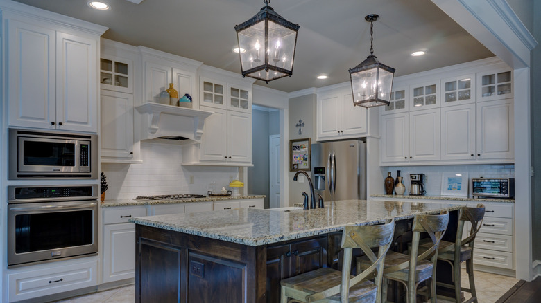 Kitchen with white cabinets and a gray ceiling