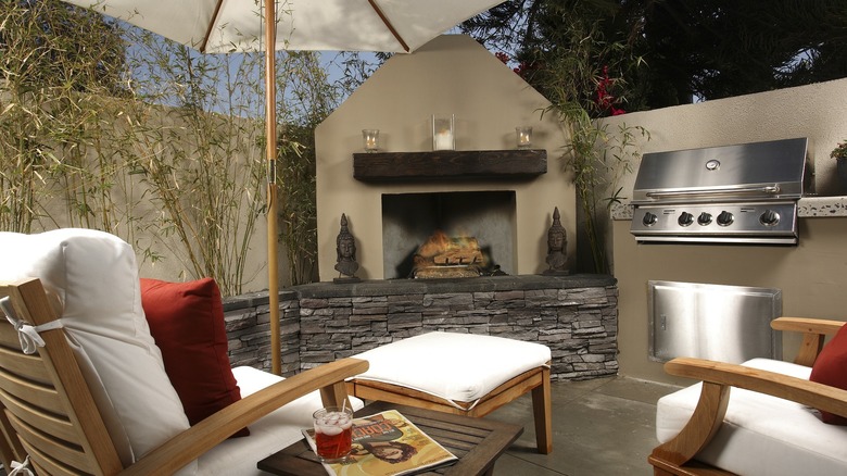 An outdoor fireplace/kitchen