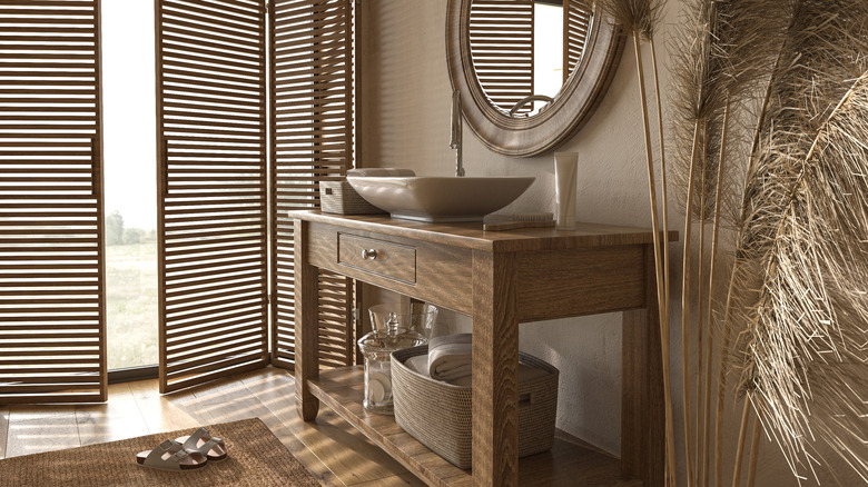 bathroom with wood vanity