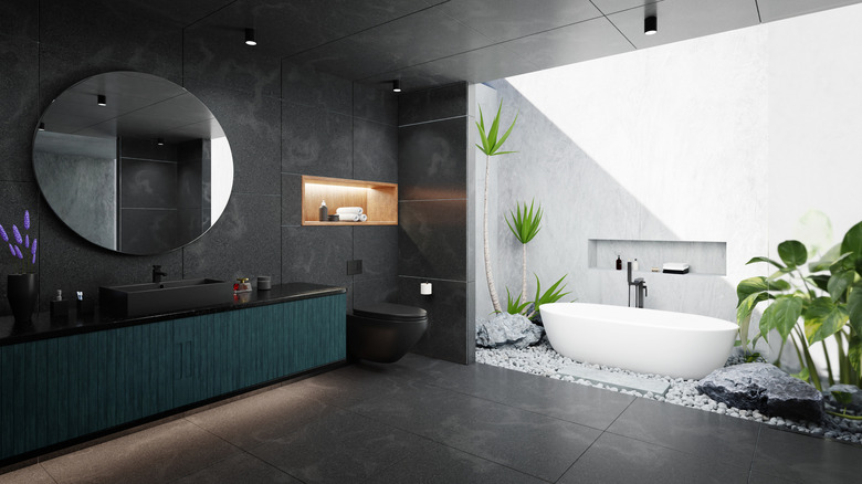 bathroom with outdoor bathtub