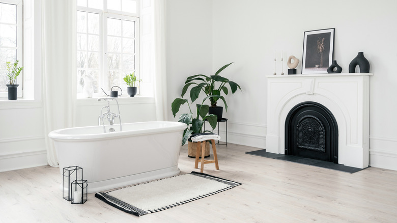 bathroom with fireplace and plants
