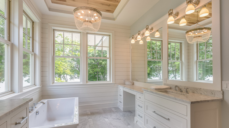 bathroom with white wood paneling