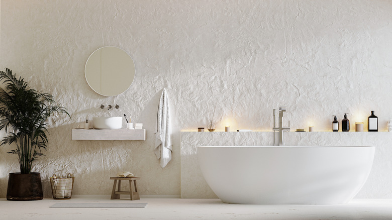 bathroom with white textured wall