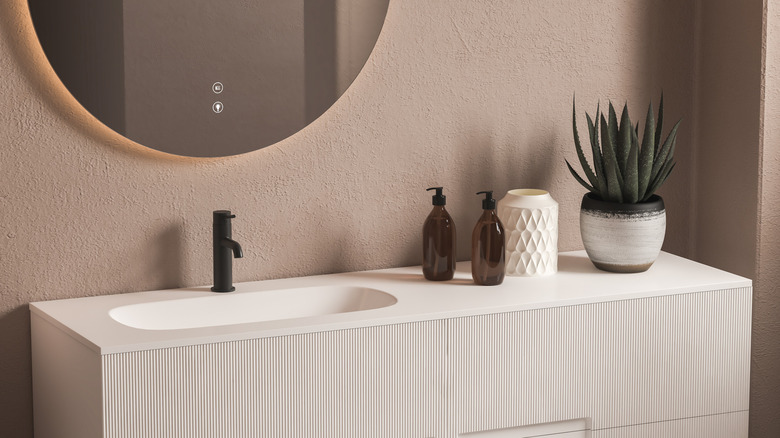 long white sink with plant