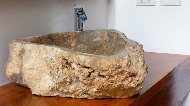 stone sink and metal tap