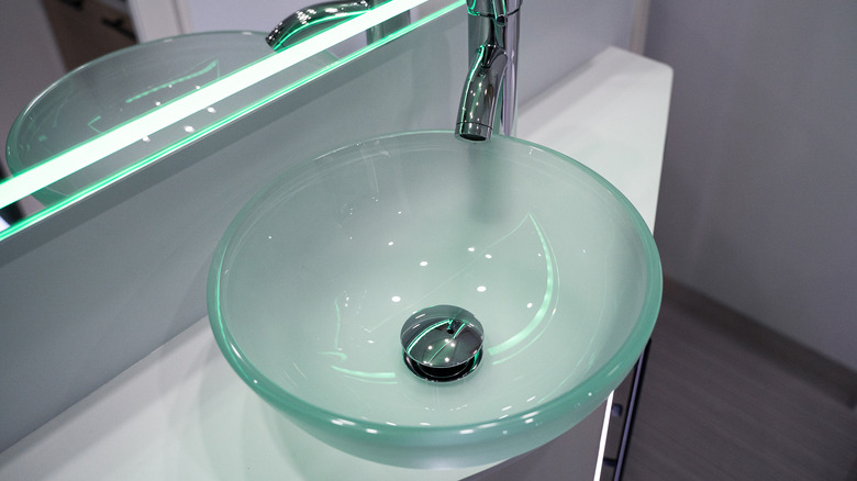 glass sink on a counter