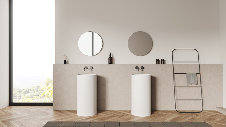 two white sink and mirrors