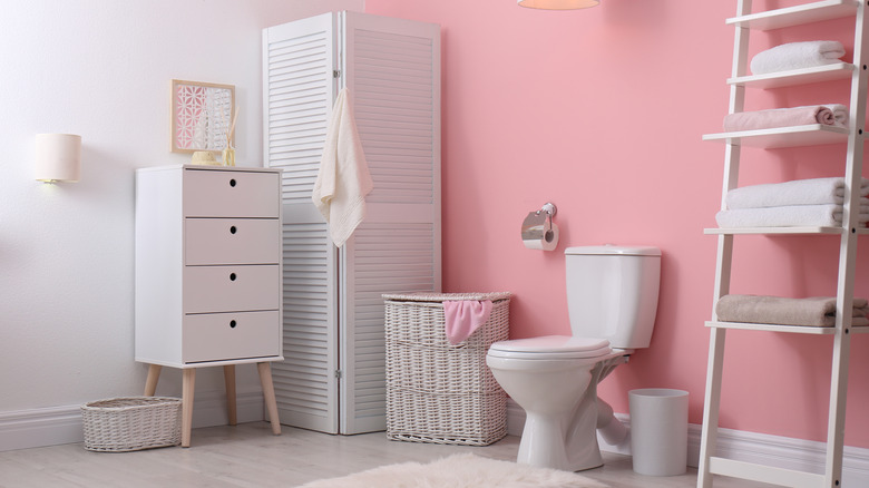 Pink accent wall bathroom