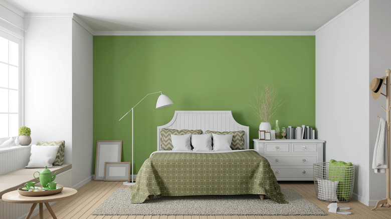 Bedroom with green accent wall