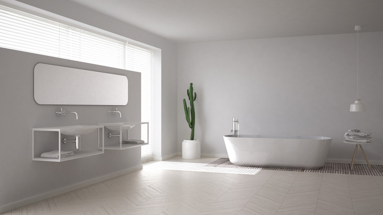 Bathroom with asymmetrical window