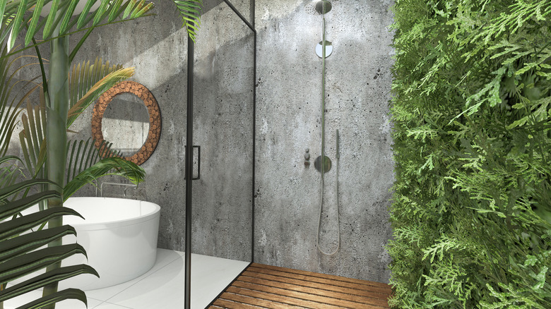 Indoor-outdoor bathroom with greenery