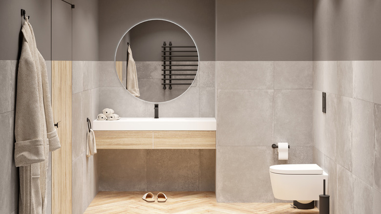 Gray bathroom with herringbone wood floors