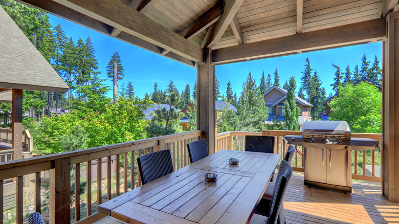 covered deck with wood table