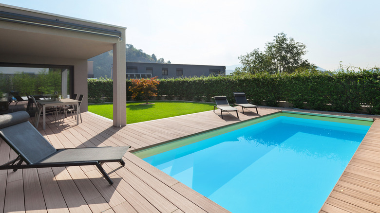 covered deck and a pool