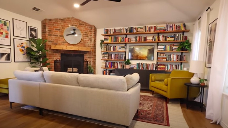 Living room with bookcase and fireplace