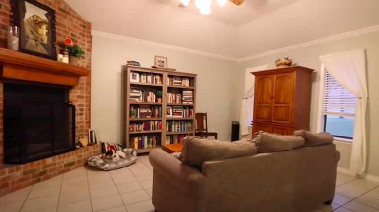 Living room with brick fireplace