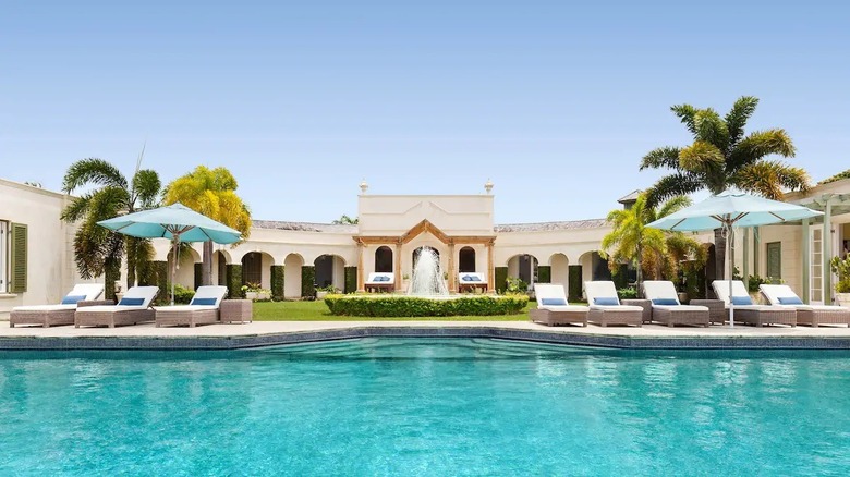 curved mansion with wide pool 