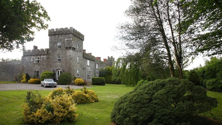 old Irish castle with a car